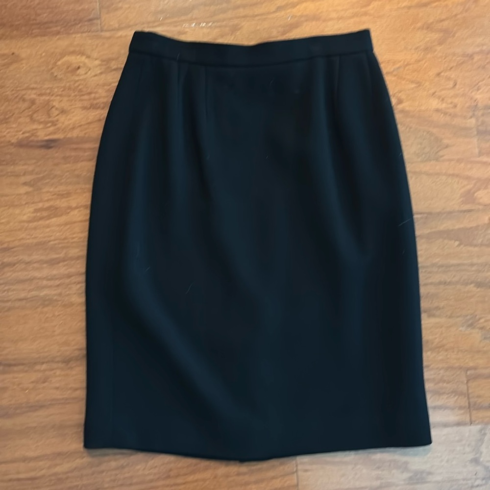 Carlisle wool skirt, size 8, black. Hits just below knee. Lined.